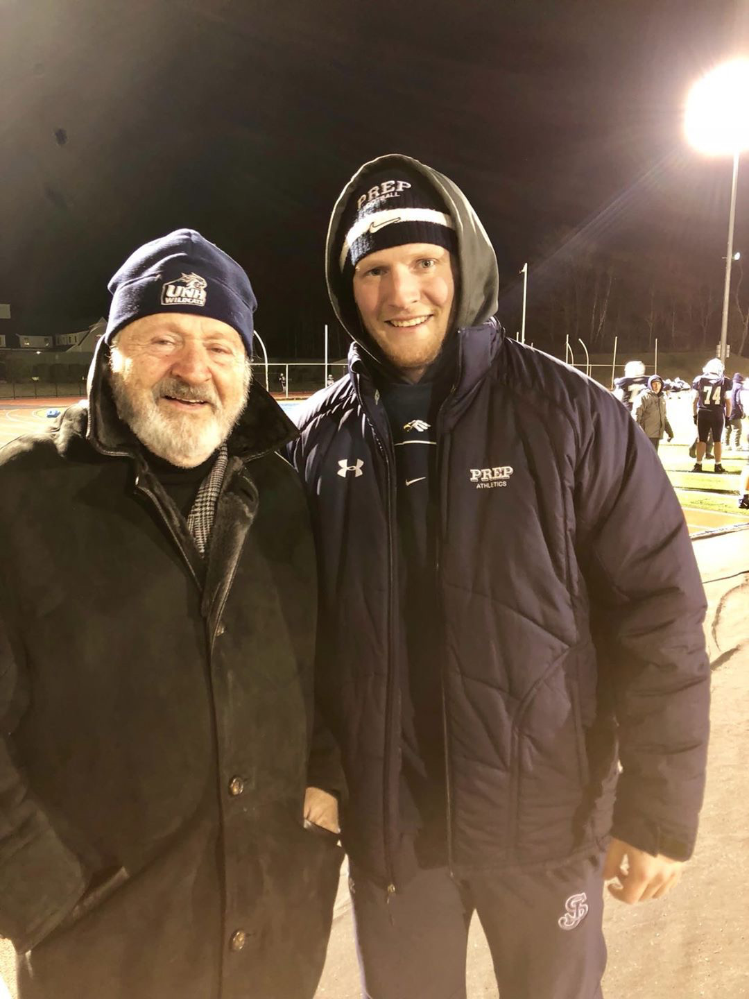 George with his grandson Logan Mahoney '14 at a St. John's Prep football game